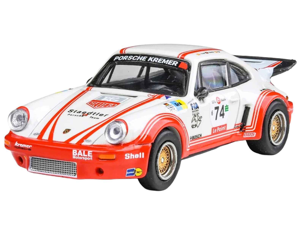 Miniature Motors Porsche 911 Carrera RSR 3.0 #74 diecast model car in white with red stripes, 1/64 scale by Paragon Models