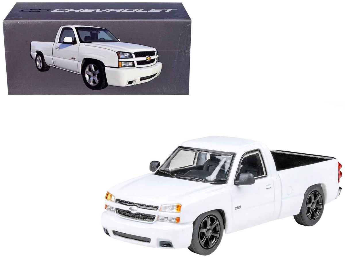 Miniature Motors 2006 Chevrolet Silverado 'Cateye' diecast model truck in Summit White, 1/64 scale by Paragon Models.