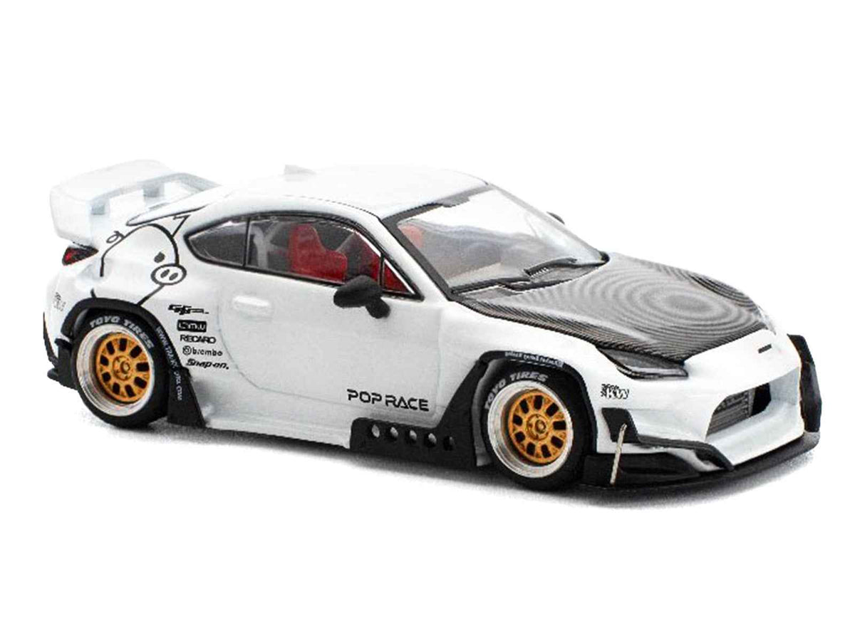 White Toyota Pandem GR86 diecast model car with carbon hood, part of Enigma Exclusive Edition by Miniature Motors, 1/64 scale.