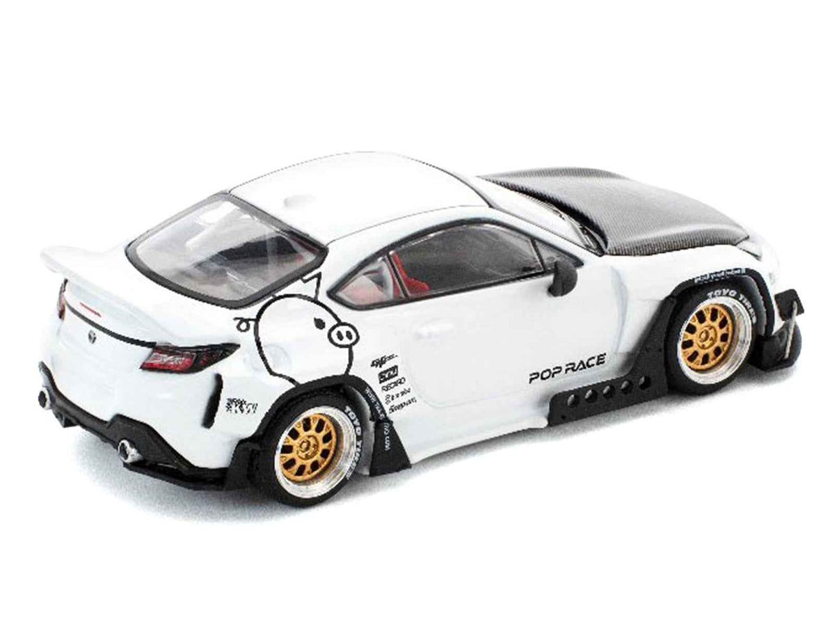 White Toyota Pandem GR86 diecast model car with carbon hood, Enigma Exclusive Edition by Miniature Motors, 1/64 scale.