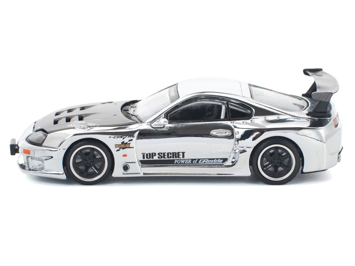 Silver chrome Toyota Supra "Top Secret" GT300 diecast model car by Miniature Motors, right-hand drive, 1/64 scale.