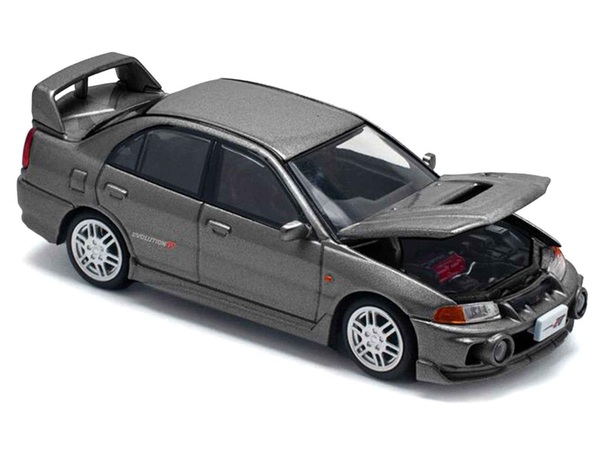 Dark gray Mitsubishi Lancer Evolution IV RHD diecast model car by Miniature Motors, detailed 1/64 scale Mitsubishi model.