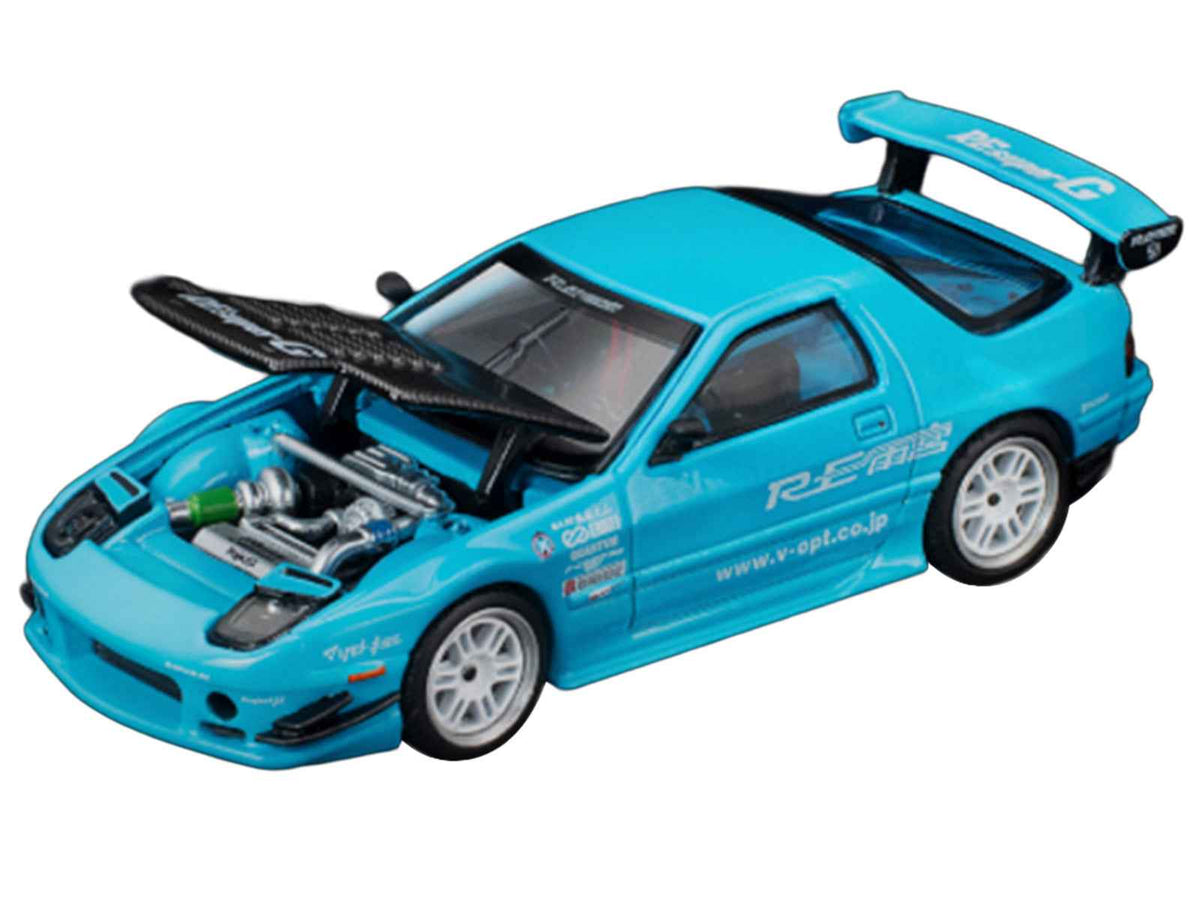 Miniature Motors Mazda RX7 FC3S RE Amemiya diecast model car in light blue with carbon hood, showcasing detailed design and RHD layout.