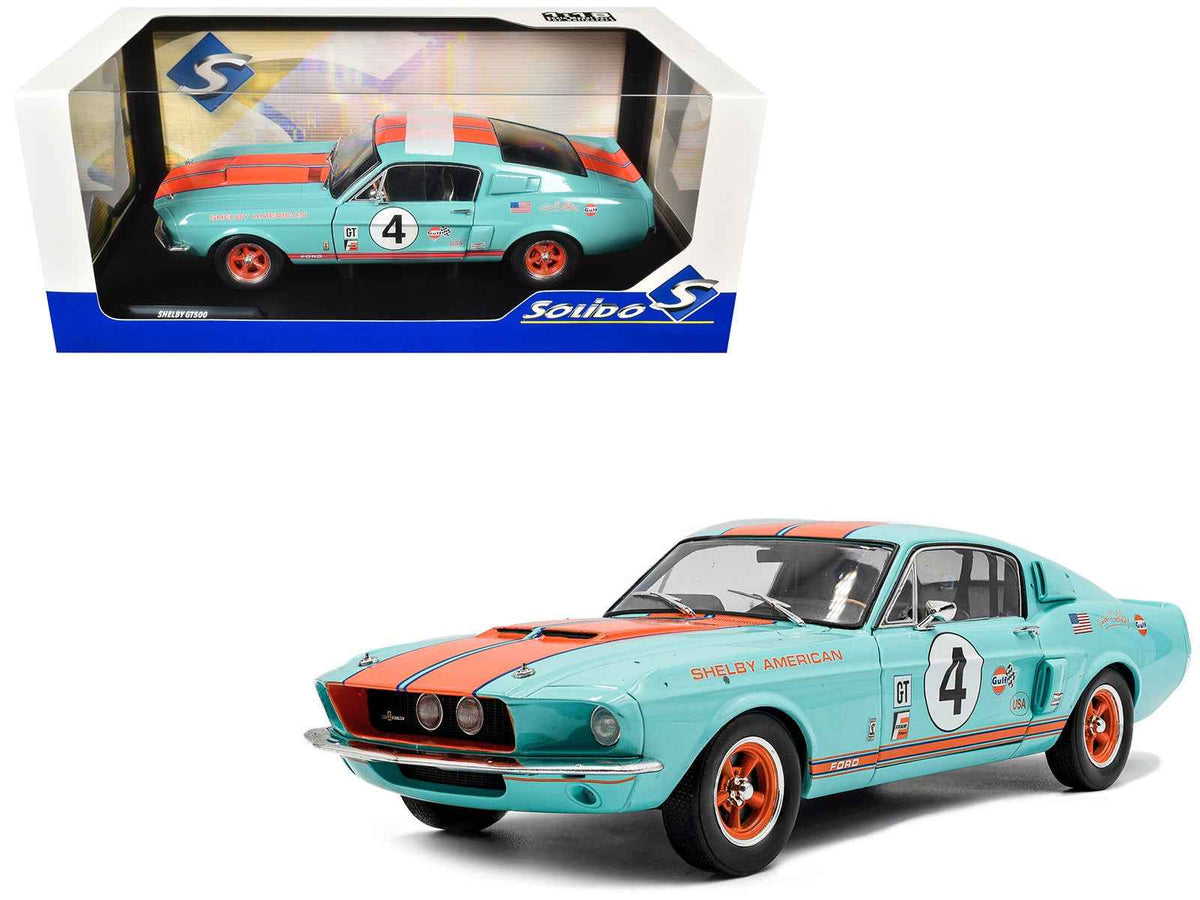 Miniature Motors 1967 Shelby GT500 #4 Gulf Racing Tribute diecast model car in light blue with orange stripes, 1/18 scale.