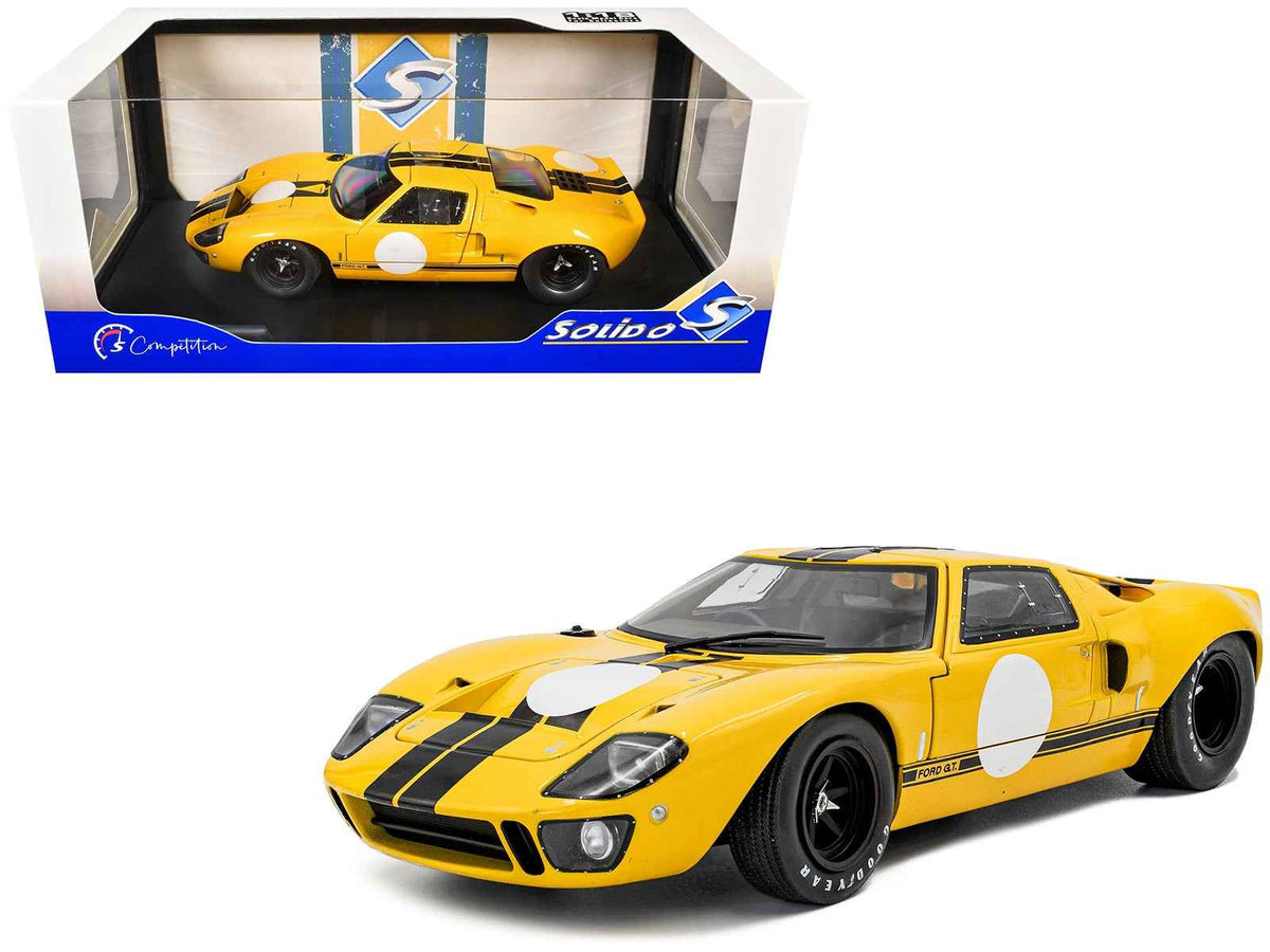 Yellow 1968 Ford GT40 MK1 diecast model car with black stripes, part of the Solido "Competition" Series, 1/18 scale.