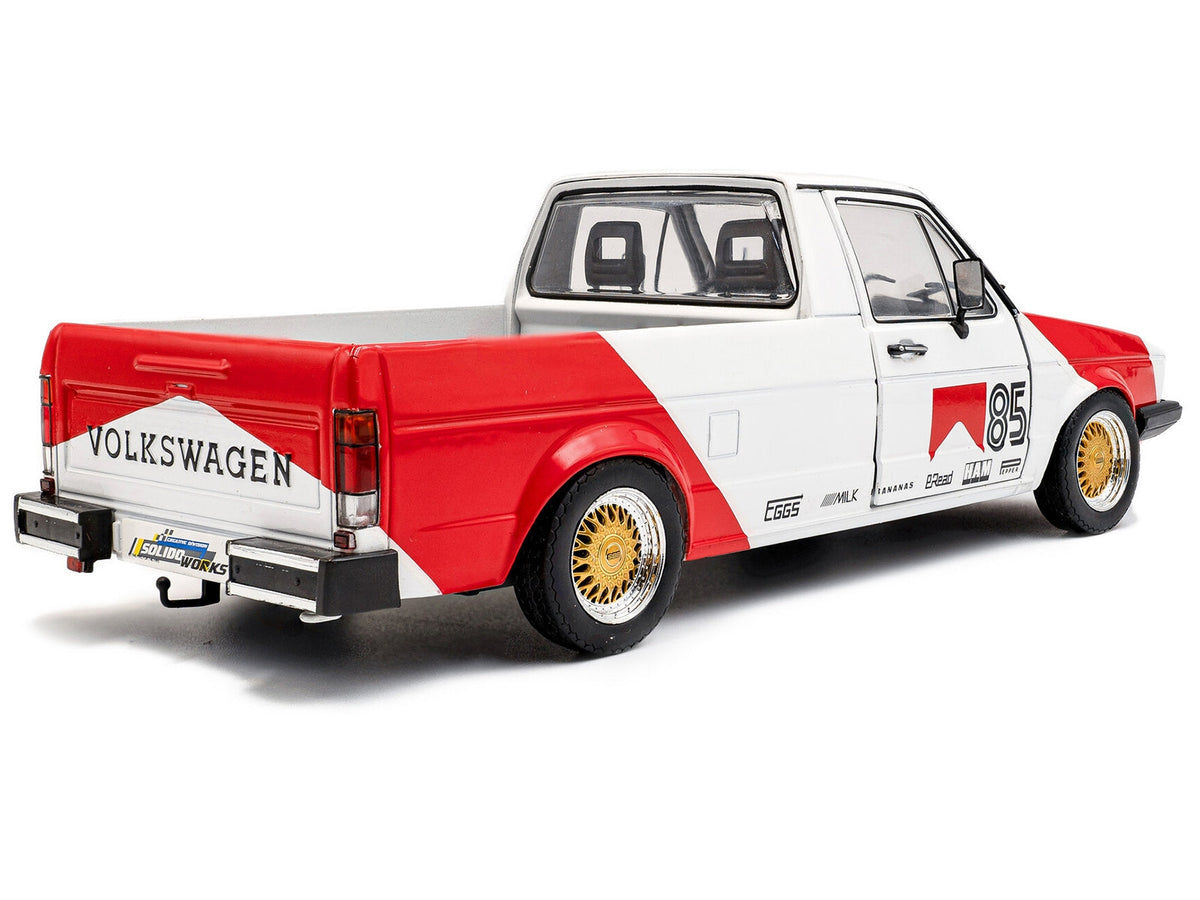 Red and white 1983 Volkswagen Caddy MK 1 Pickup diecast model by Solido, featuring "Red Cowboy Racing Tribute" details.