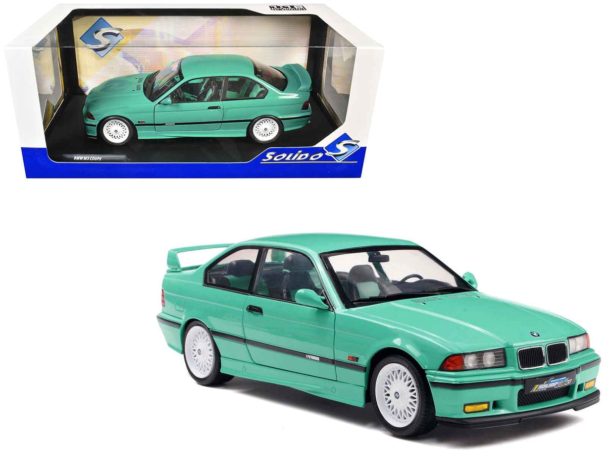 Mint green 1991 BMW E36 M3 Solido Works diecast model car with mint green interior, 1/18 scale, by Miniature Motors.