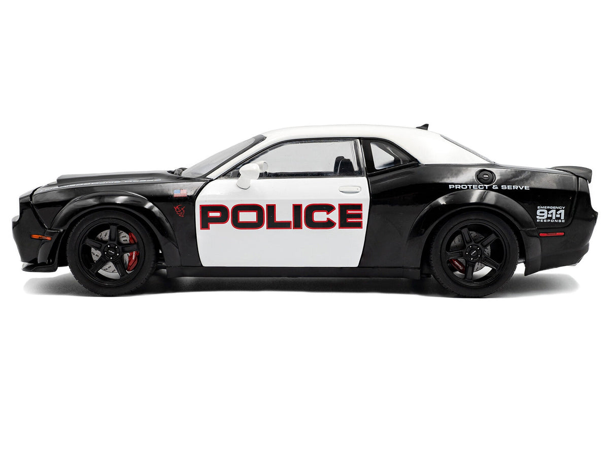 Black and white 1/18 Dodge Challenger Demon "Police" diecast model car by Solido, detailed miniature vehicle for collectors.