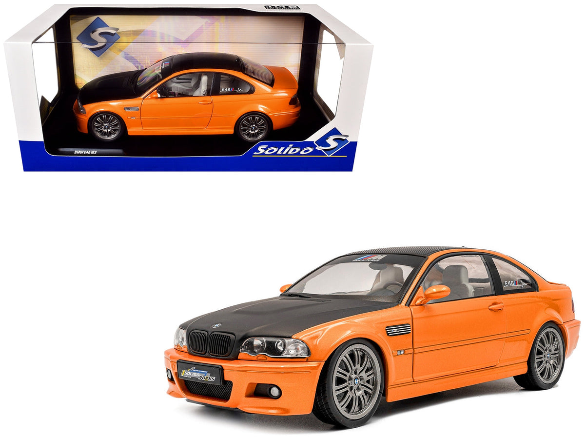 Miniature Motors 1/18 BMW E46 M3 Solido Works diecast model car in orange metallic with matte black hood and carbon top.