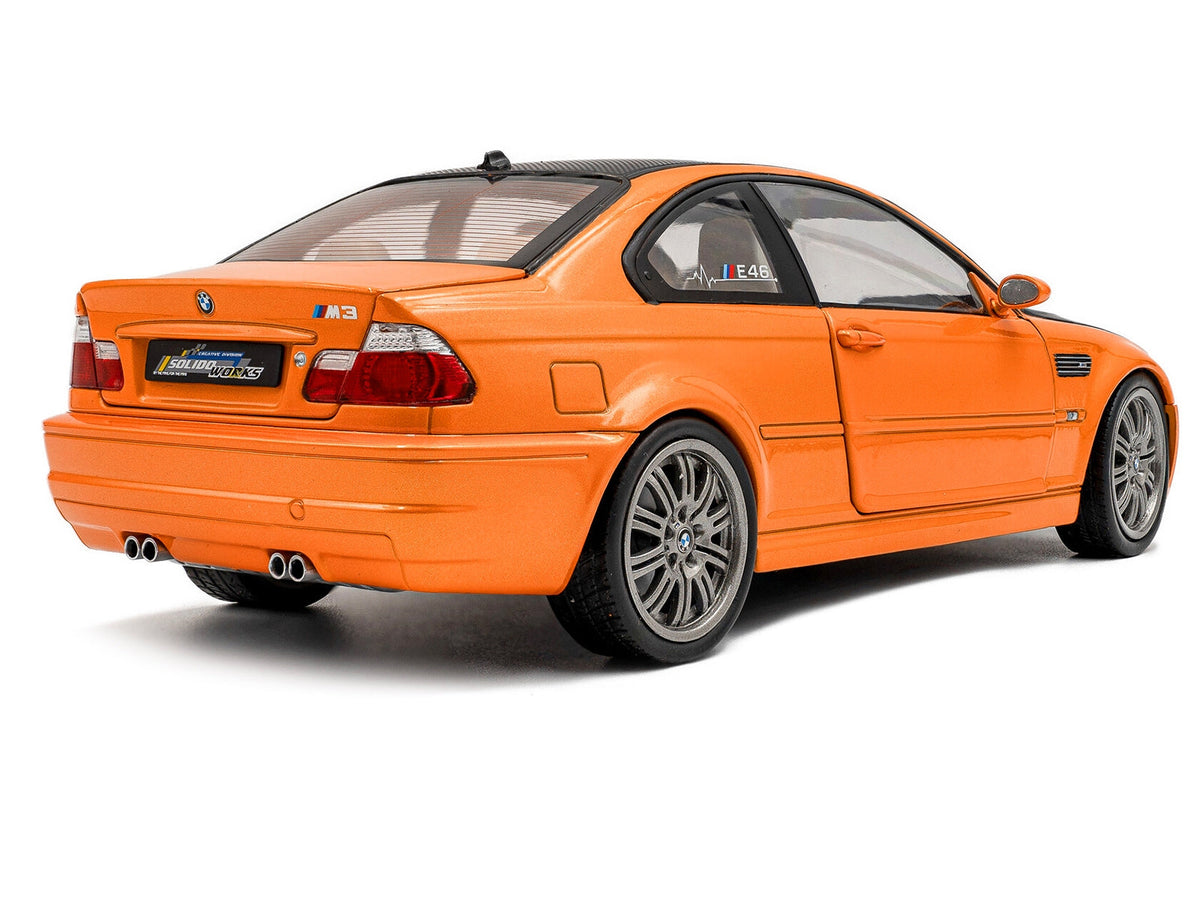 Orange metallic BMW E46 M3 diecast model by Solido, with matte black hood and carbon top, detailed 1/18 scale miniature car.