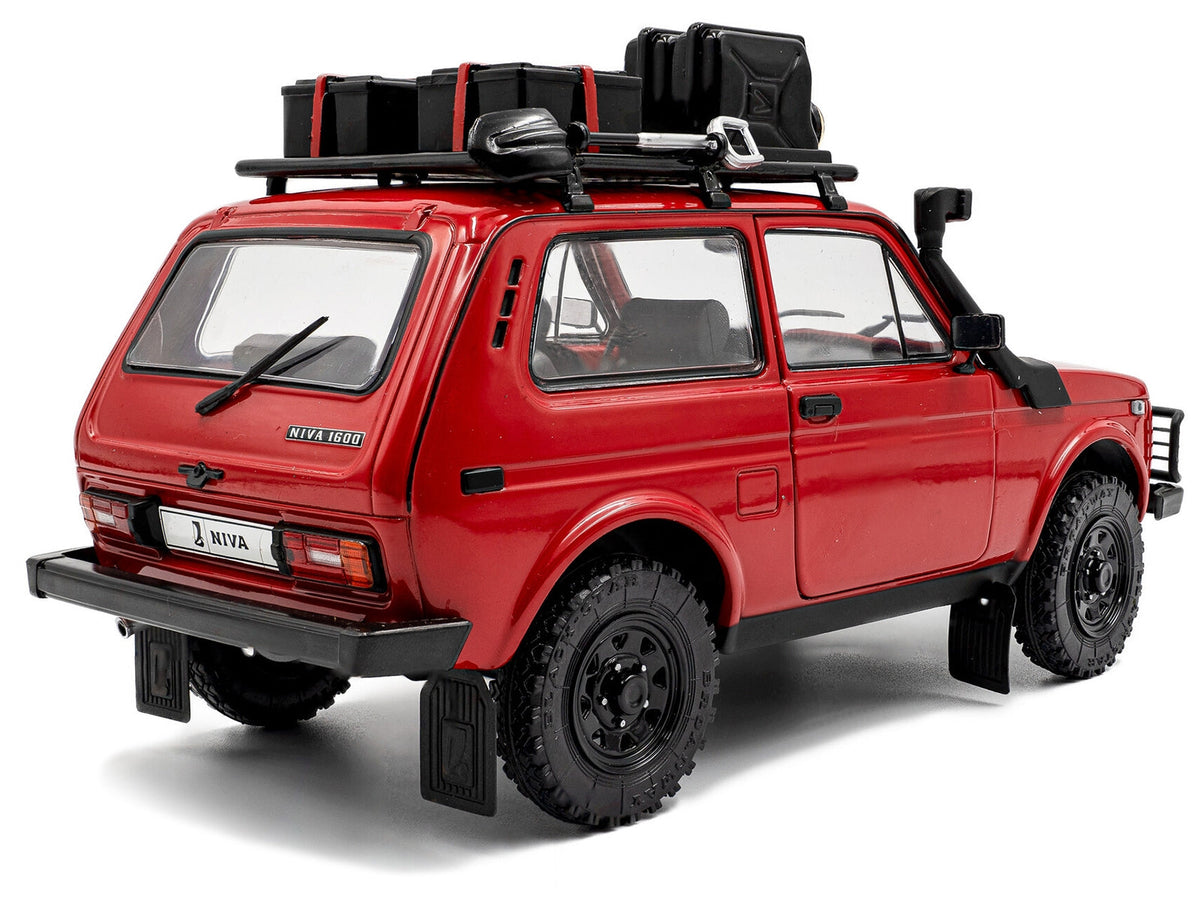Red 1980 Lada Niva diecast model car with roof rack and accessories by Solido, detailed Miniature Motors 1/18 scale.