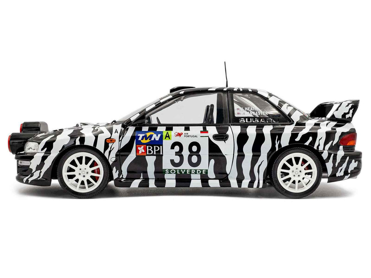 Miniature Motors Subaru Impreza S5 WRC99 #38 Nigel Heath rally car diecast model by Solido, detailed 1/18 scale for collectors.