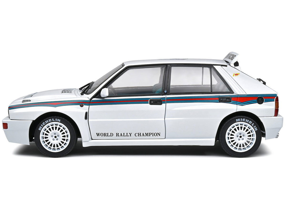 Miniature Motors 1/18 Lancia Delta HF Integrale Evo 1 Martini rally model car in white with blue and red stripes, diecast by Solido