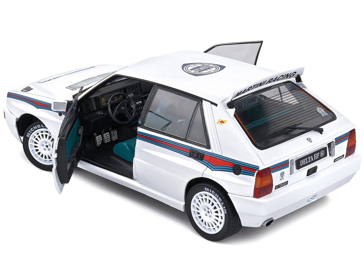 Miniature Motors 1/18 diecast model of 1992 Lancia Delta HF Integrale Evo 1 Martini racing car with white, blue, and red stripes.