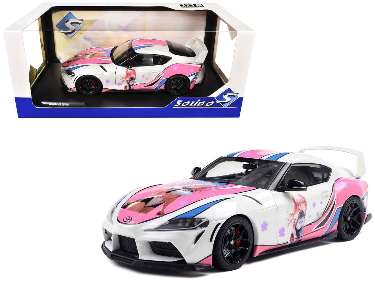 White 2024 Toyota GR Supra Itasha diecast model car with StreetFighters graphics, 1/18 scale by Solido.