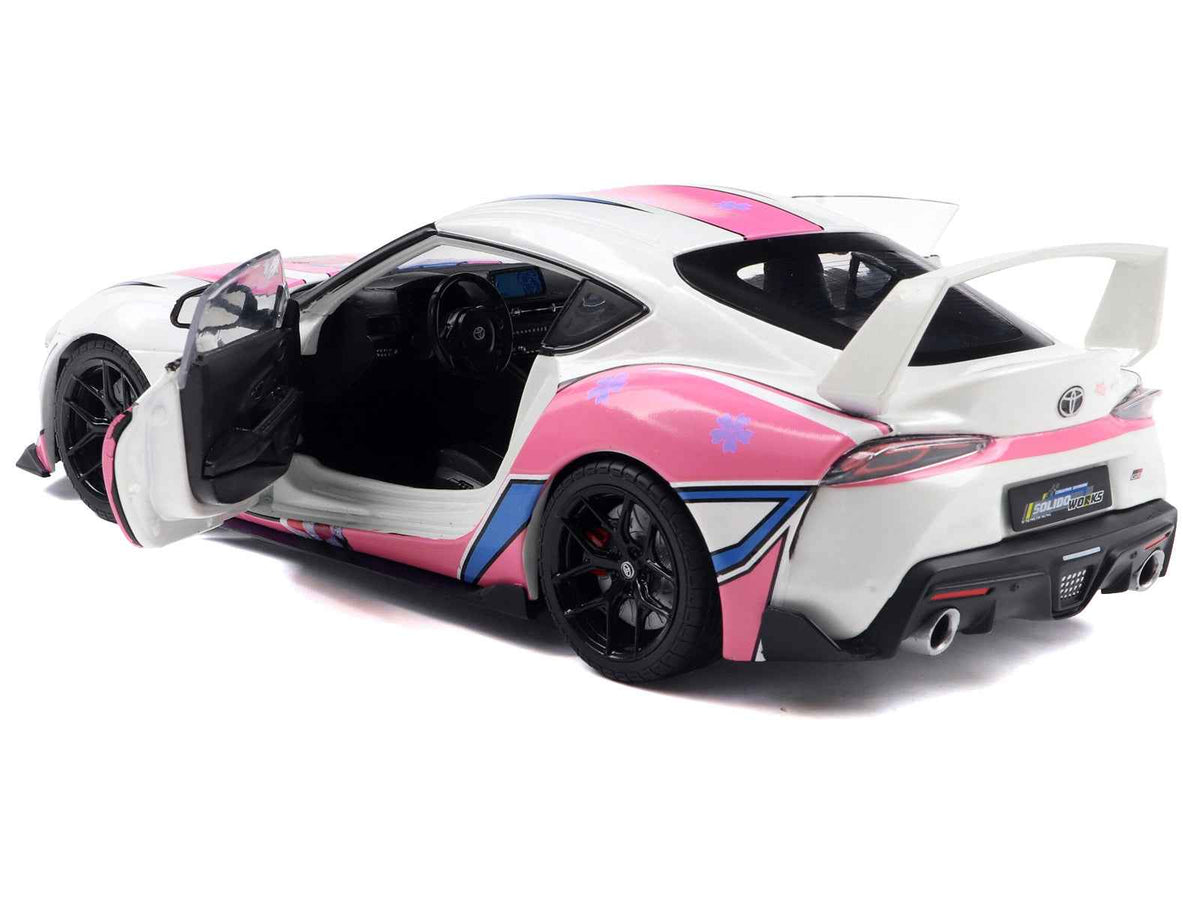 2024 Toyota GR Supra Itasha diecast model car in white with StreetFighters graphics by Solido, 1/18 scale, detailed miniature vehicle