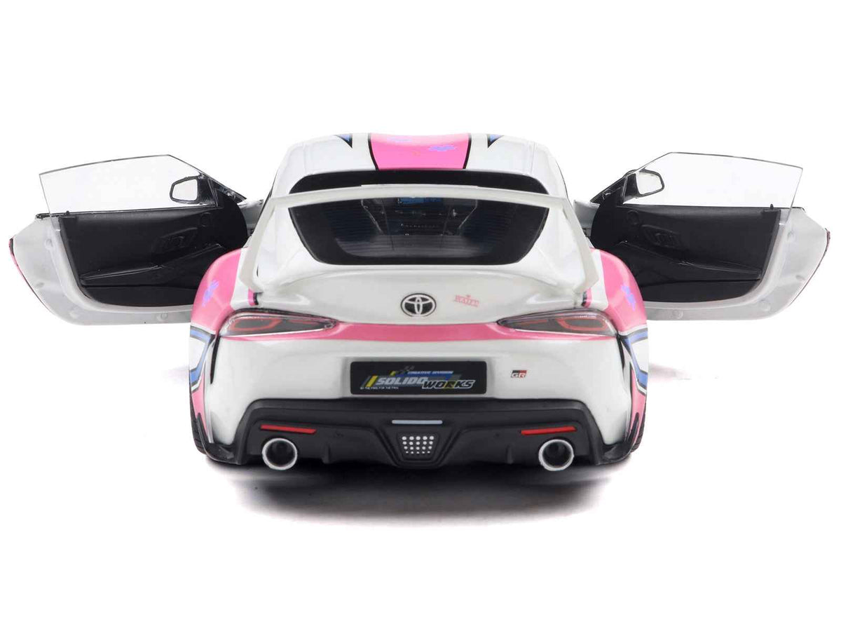 White 1/18 scale Toyota GR Supra Itasha diecast model car with StreetFighters graphics by Solido, detailed miniature Toyota model.
