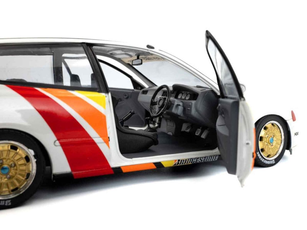White 1991 Honda Civic EG6 Mugen Racing 1/18 diecast model car by Solido, featuring racing stripes and right-hand drive detail.
