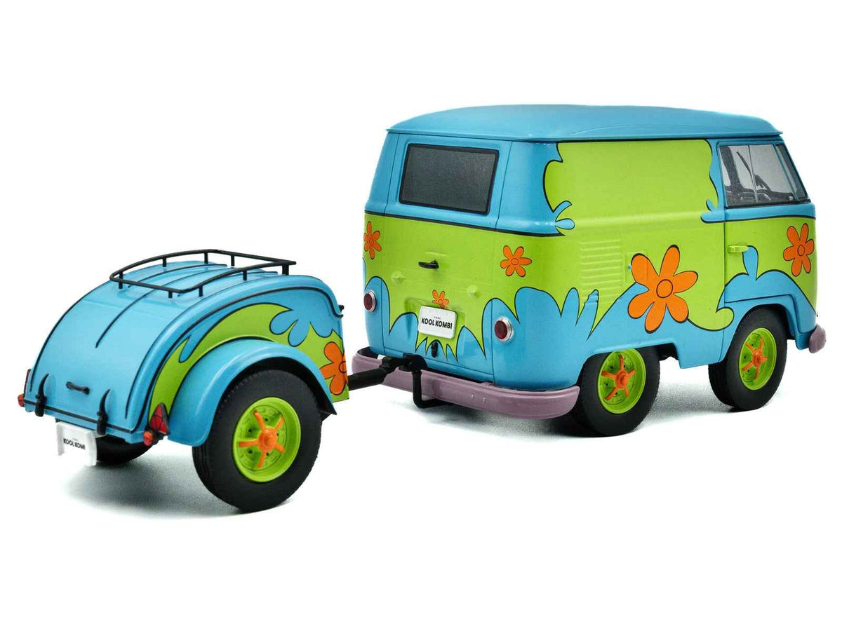 Miniature 2024 Volkswagen Kool Kombi Van with Ghost Hunter trailer diecast model in blue and green, detailed graphics, by Solido.