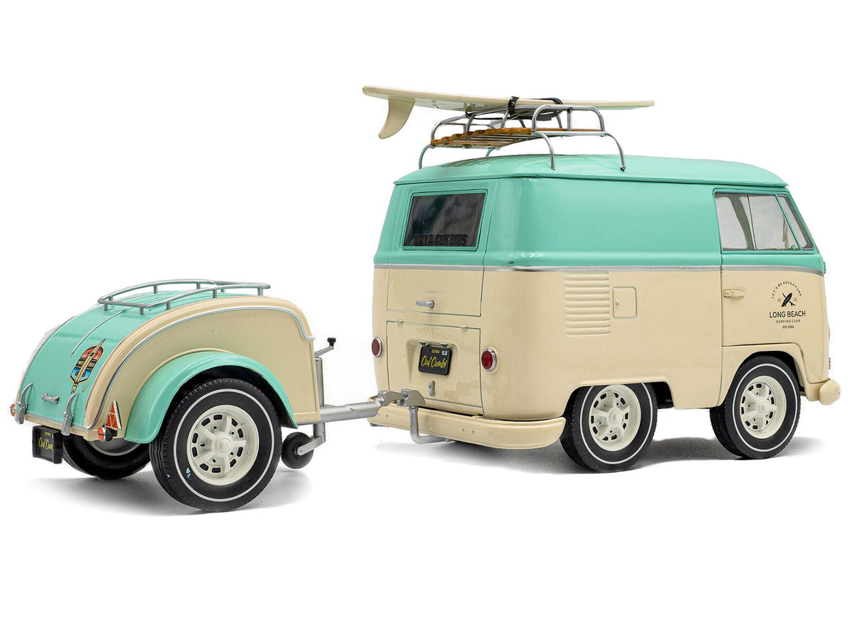 Mint green and cream 2024 Volkswagen Cool Combi van with trailer, roof rack, and surfboard diecast model by Solido.