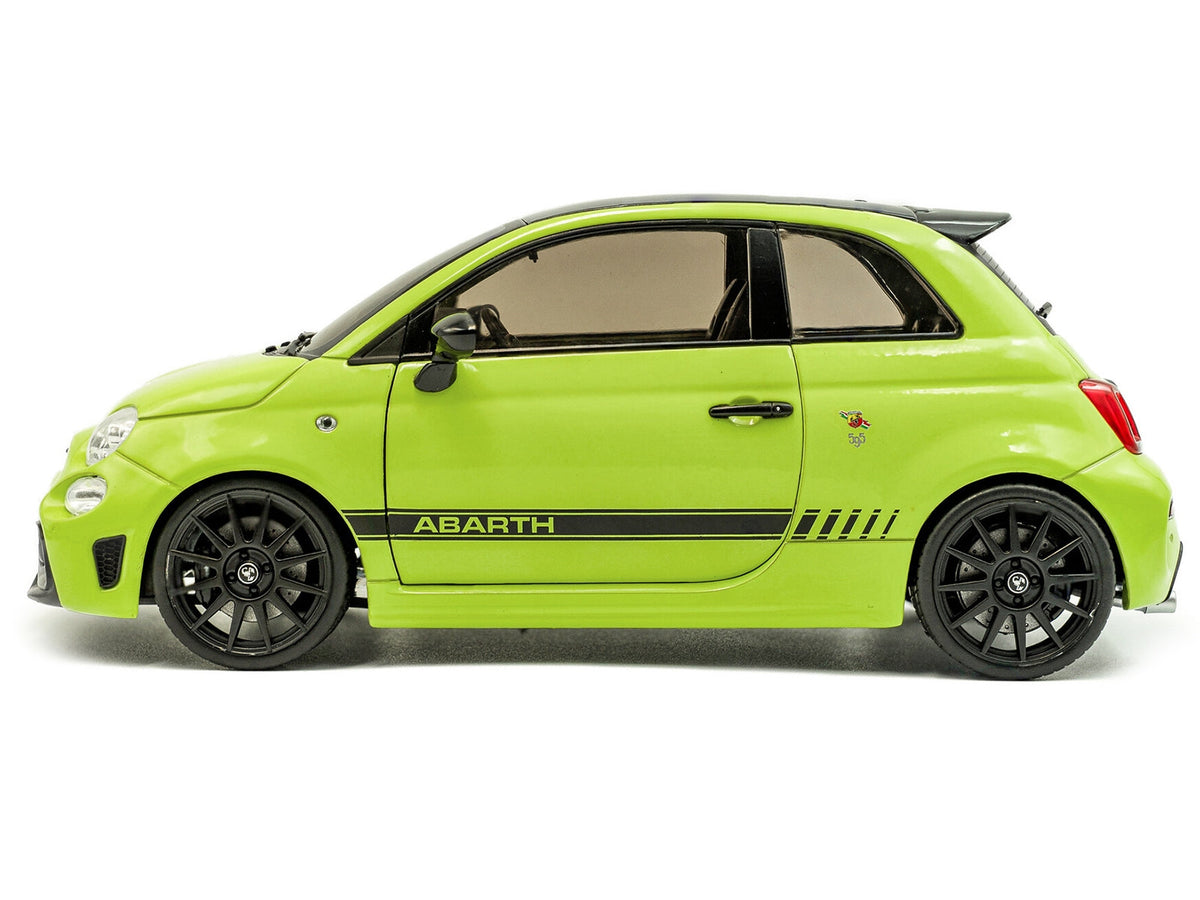 Miniature green 2023 Fiat F595 Abarth diecast model car with black top and stripes, detailed 1/18 scale by Solido