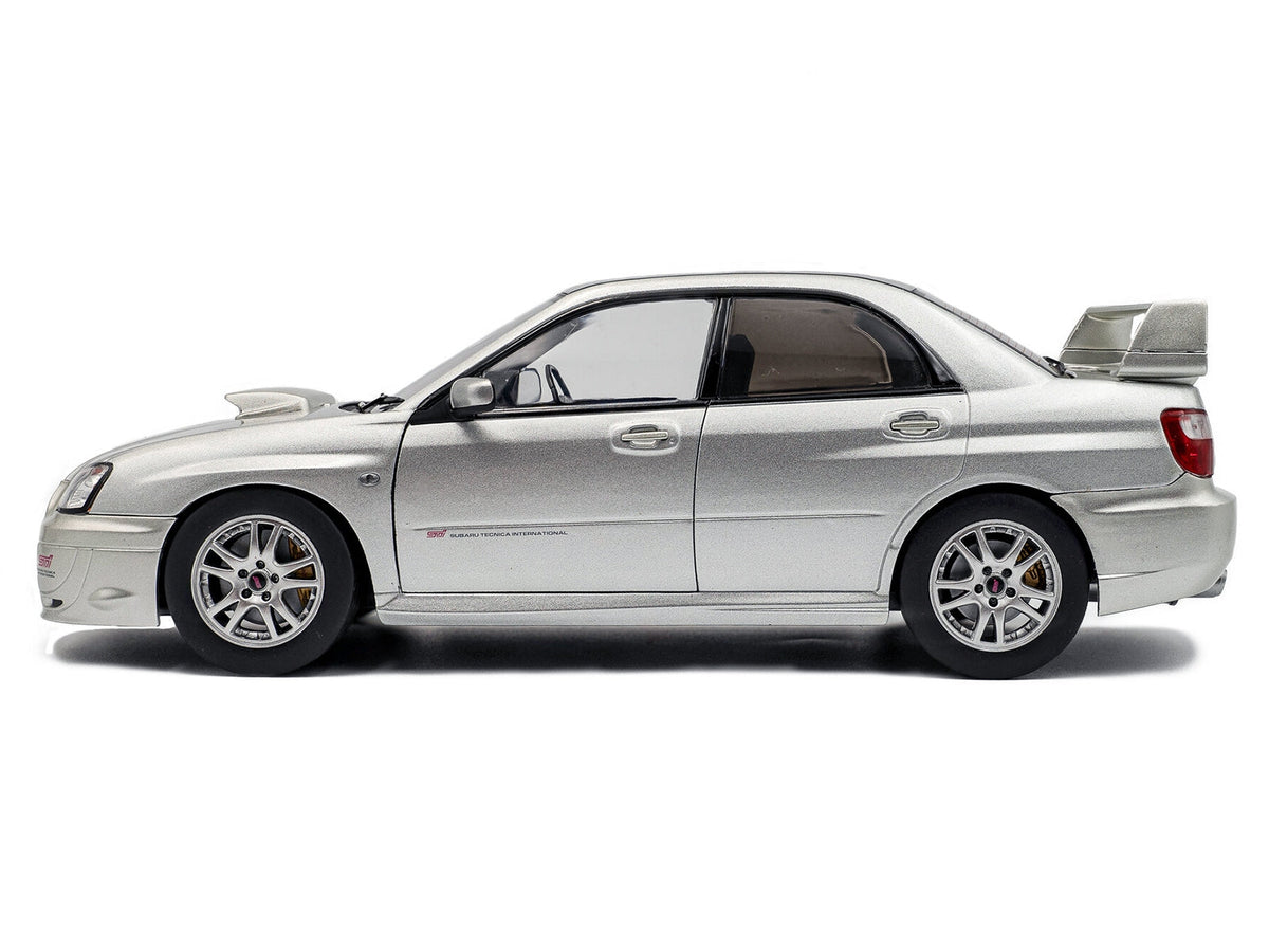 Silver 2004 Subaru Impreza WRX STI RHD 1/18 diecast model car by Solido, detailed miniature Subaru model from Miniature Motors.