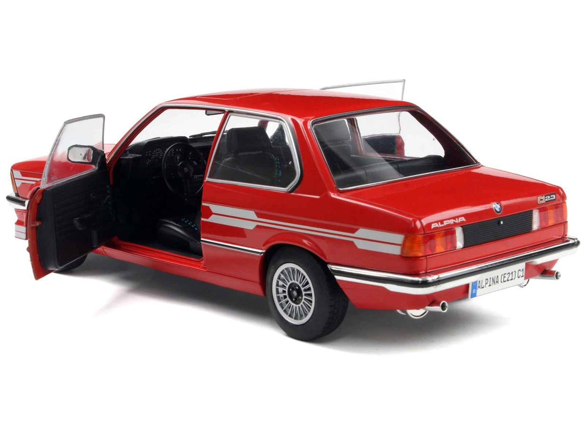 Red Alpina E21 C1 2.3 diecast model car with gray stripes, 1/18 scale by Solido, detailed miniature collectible.