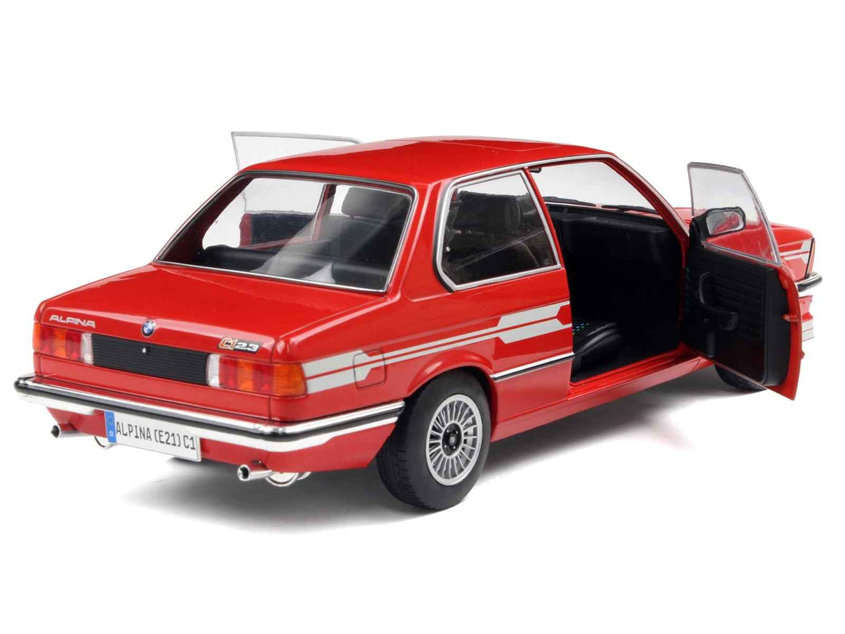Red Alpina E21 C1 2.3 diecast model car with gray stripes, 1/18 scale by Solido, detailed miniature collectible.