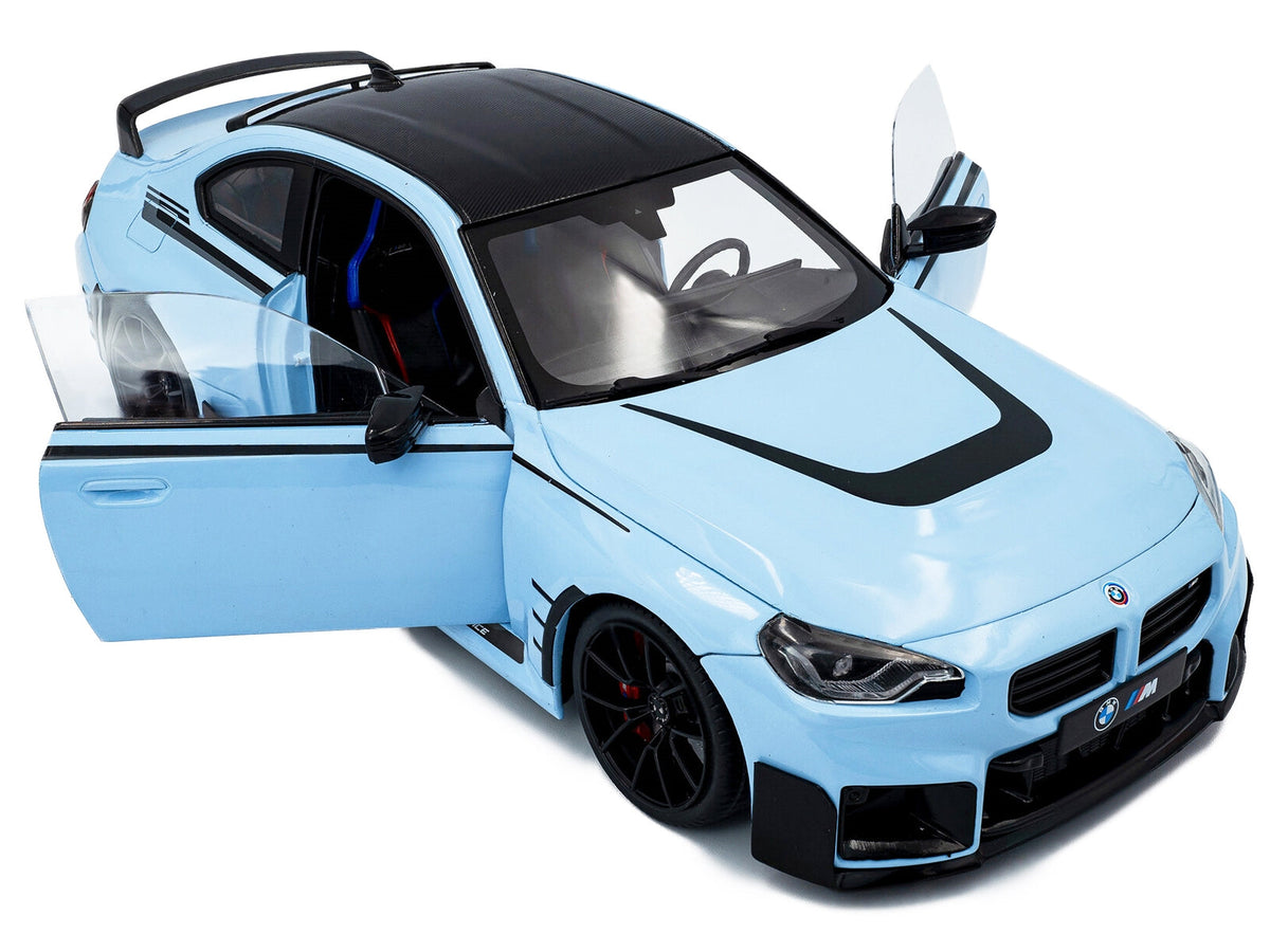 2024 BMW M2 diecast model car by Solido, Zandvoort Blue with carbon top and black stripes, detailed miniature BMW model.
