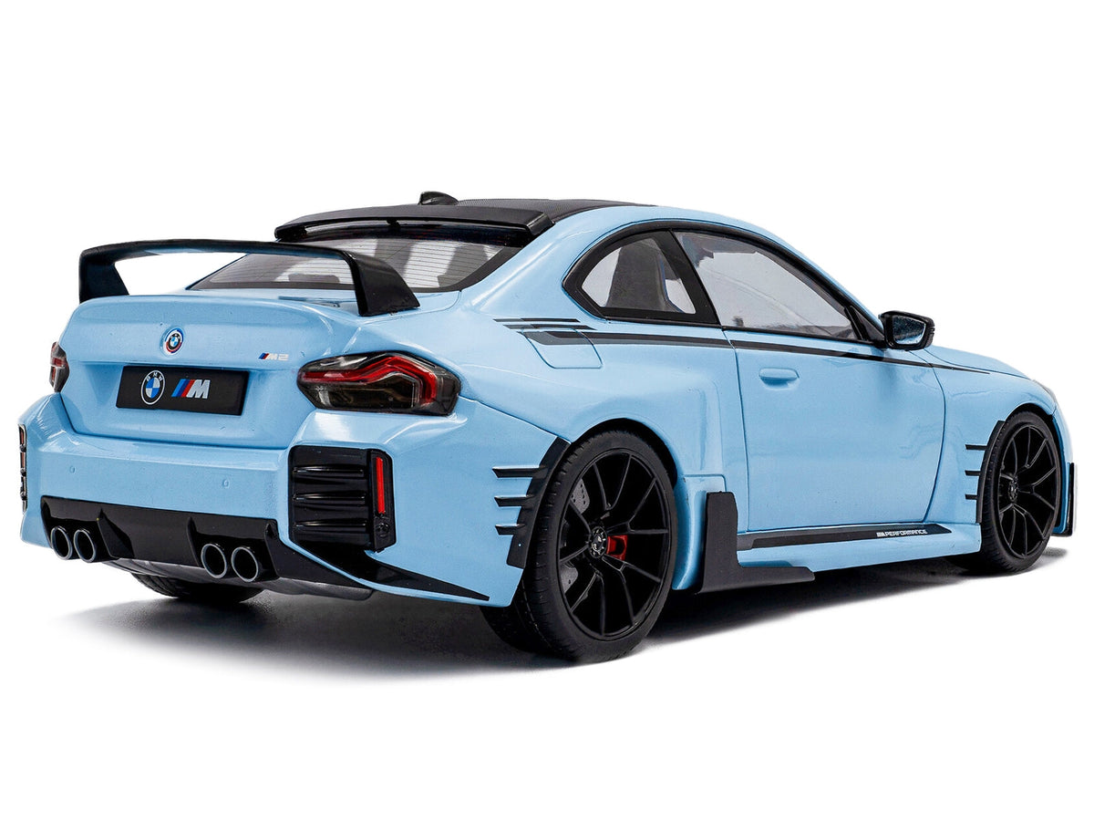 2024 BMW M2 diecast model car in Zandvoort Blue with carbon top and black stripes, detailed miniature by Solido.