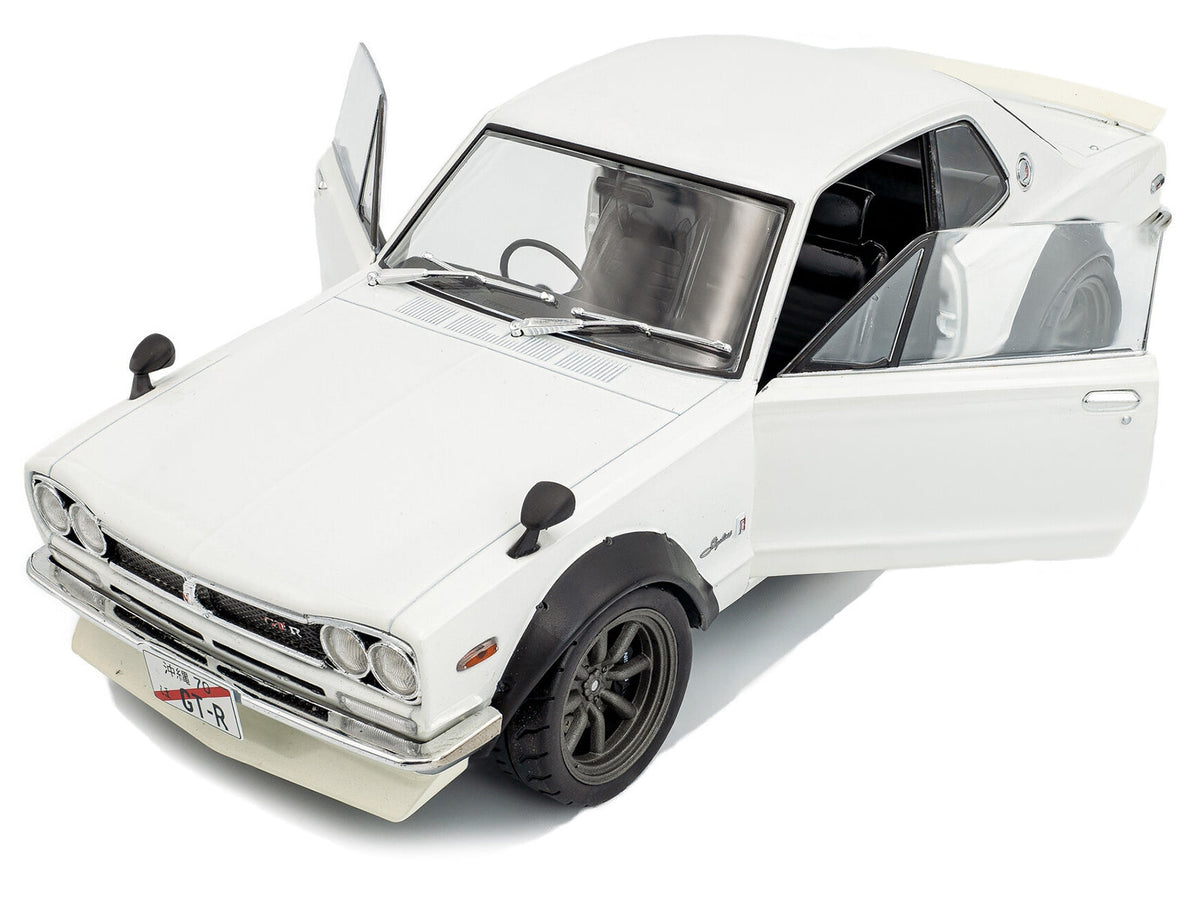 White 1970 Nissan Skyline C10 Hakosuka diecast model car in 1/18 scale by Solido, detailed Nissan model with RHD steering.