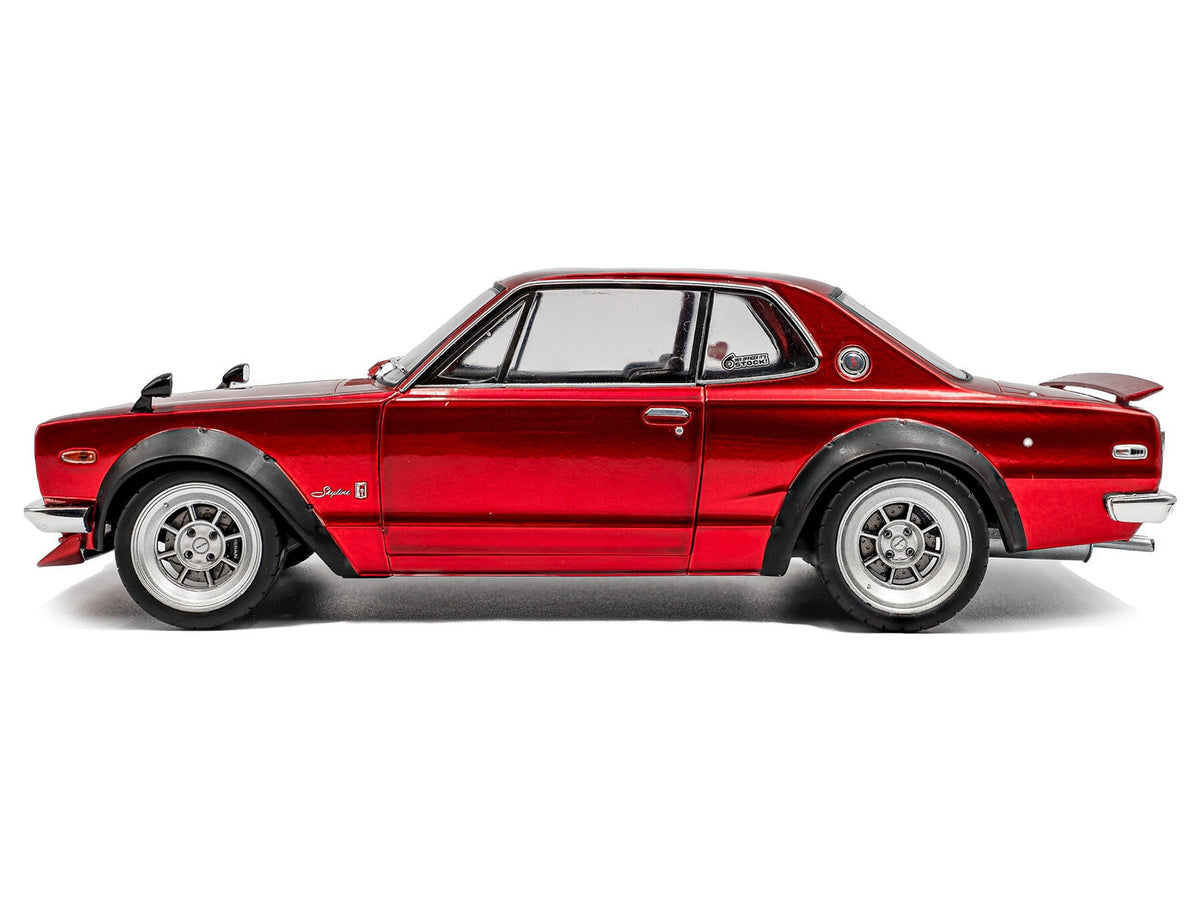 Red metallic 1970 Nissan Skyline C10 Hakosuka diecast model car by Solido, RHD, 1/18 scale, detailed miniature Nissan model.
