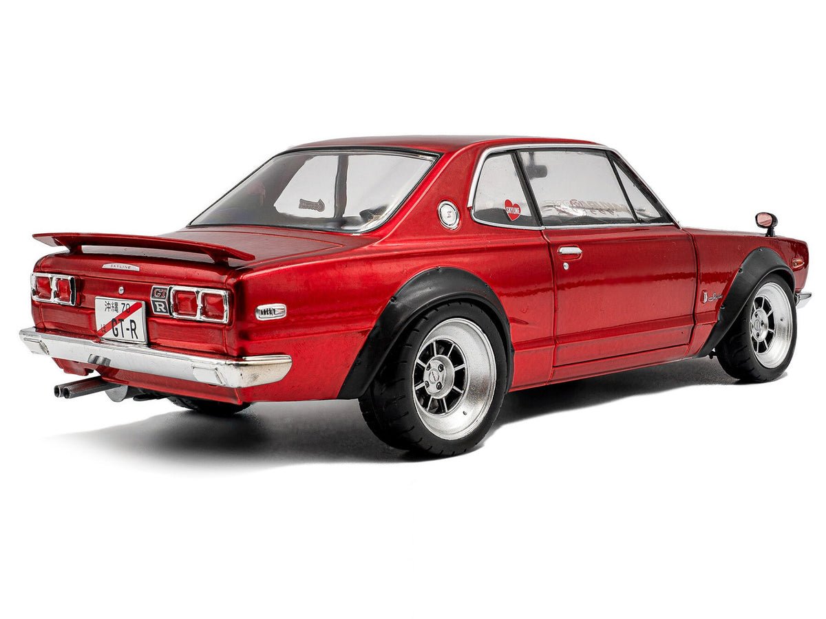 Red metallic 1/18 diecast Nissan Skyline C10 Hakosuka model car by Miniature Motors, detailed right-hand drive Nissan model.