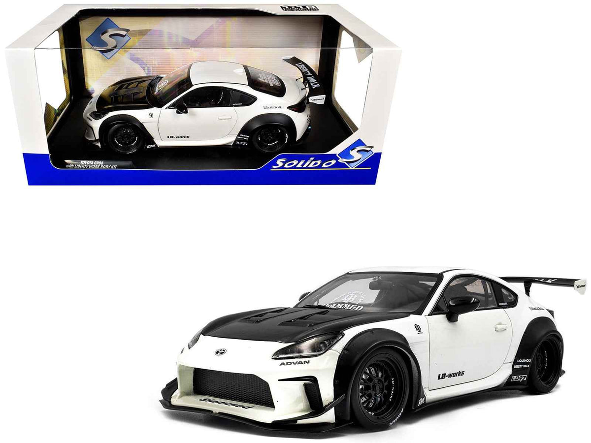 2024 Toyota GR86 LBWK diecast model car in pearl white with carbon hood, RHD, 1/18 scale by Solido, detailed miniature vehicle.