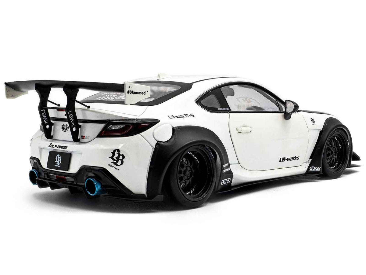 2024 Toyota GR86 LBWK diecast model by Solido, pearl white with carbon hood, right-hand drive, 1/18 scale, detailed miniature car.