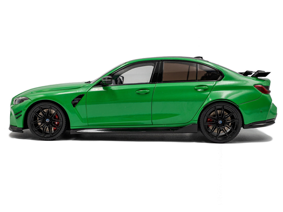 Miniature 2024 BMW M3 Competition Signal Green diecast model car by Solido, with carbon fiber top, 1/18 scale, detailed display.
