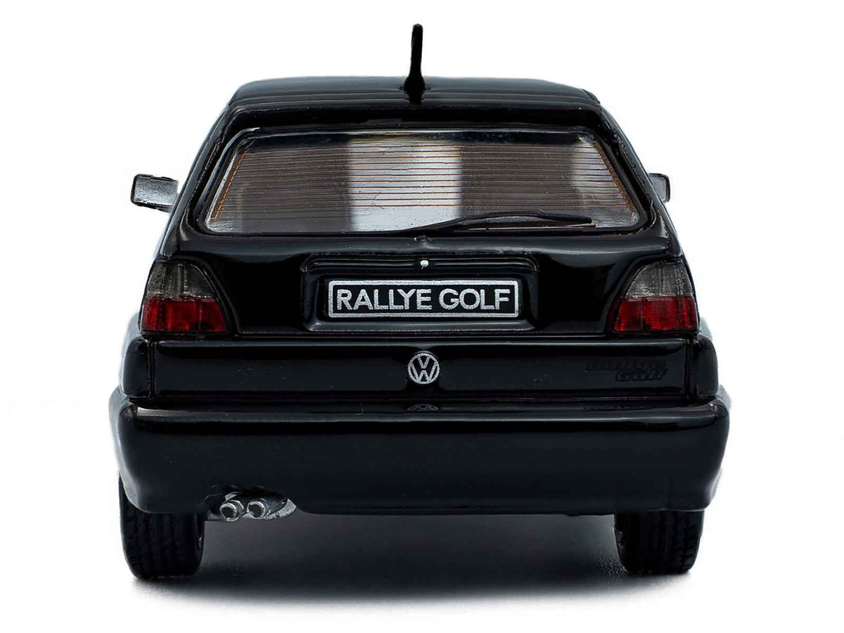 Black 1989 Volkswagen Golf Rallye G60 1/43 diecast model car by Solido, detailed miniature Volkswagen model in a realistic pose.