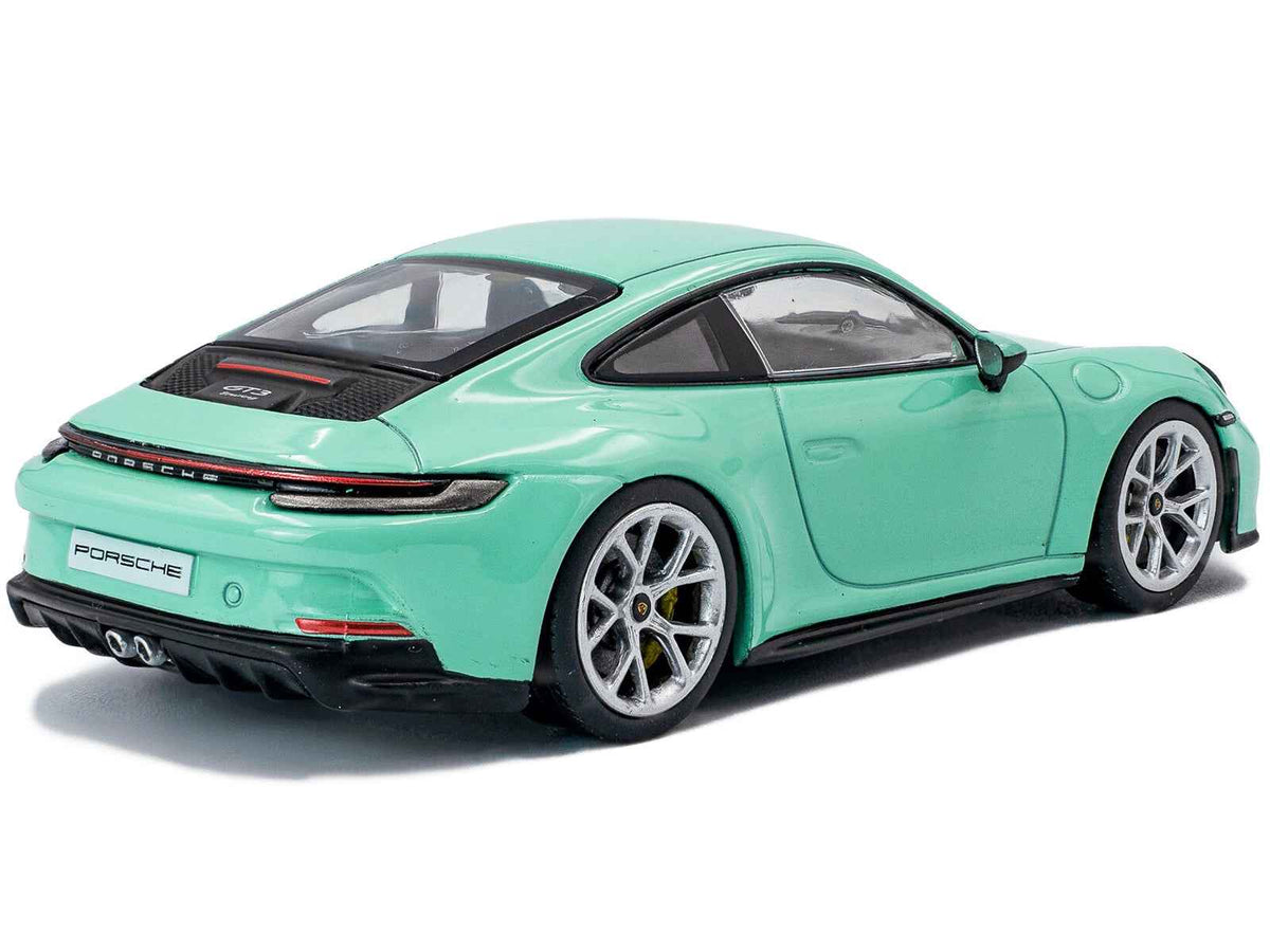 Mint green 1/43 scale Porsche 911 (992) GT3 Touring diecast model car by Solido, detailed miniature automotive collectible.