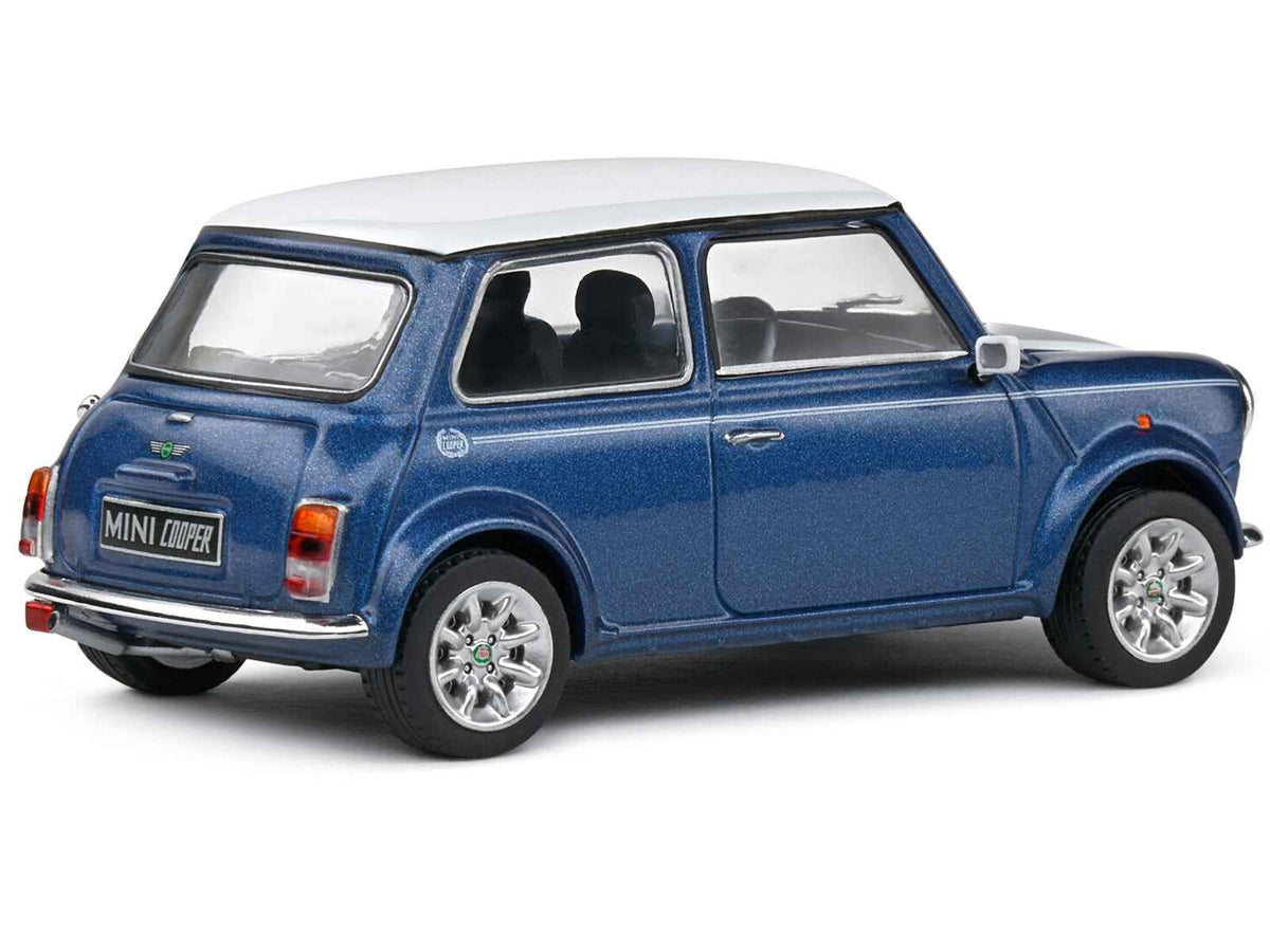 Miniature Motors 1994 Mini Cooper Sport diecast model in Tahiti Blue Metallic with white top and stripes, 1/43 scale by Solido