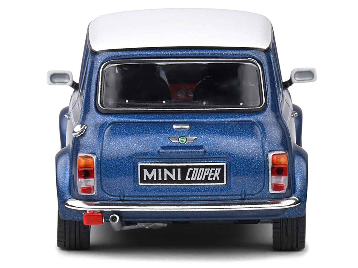 Mini Cooper Sport 1994 diecast model car in Tahiti Blue Metallic with white top and stripes by Miniature Motors, 1/43 scale.