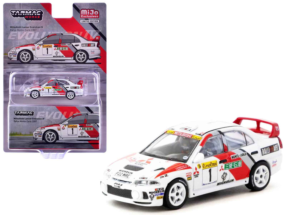 Miniature Mitsubishi Lancer Evolution IV model by Tarmac Works, featuring Tommi Makinen and Seppo Harjanne at 1997 Monte Carlo Rally.