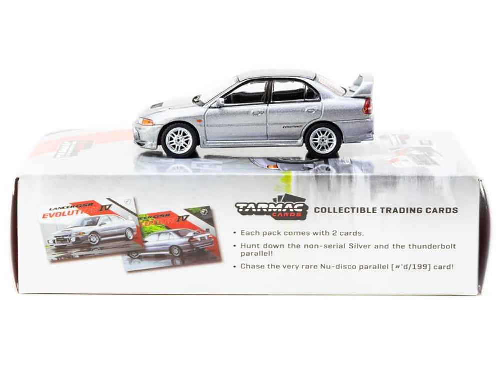 Silver metallic Mitsubishi Lancer Evolution IV diecast model by Tarmac Works, detailed miniature car with Tarmac cards, part of Global64 series.