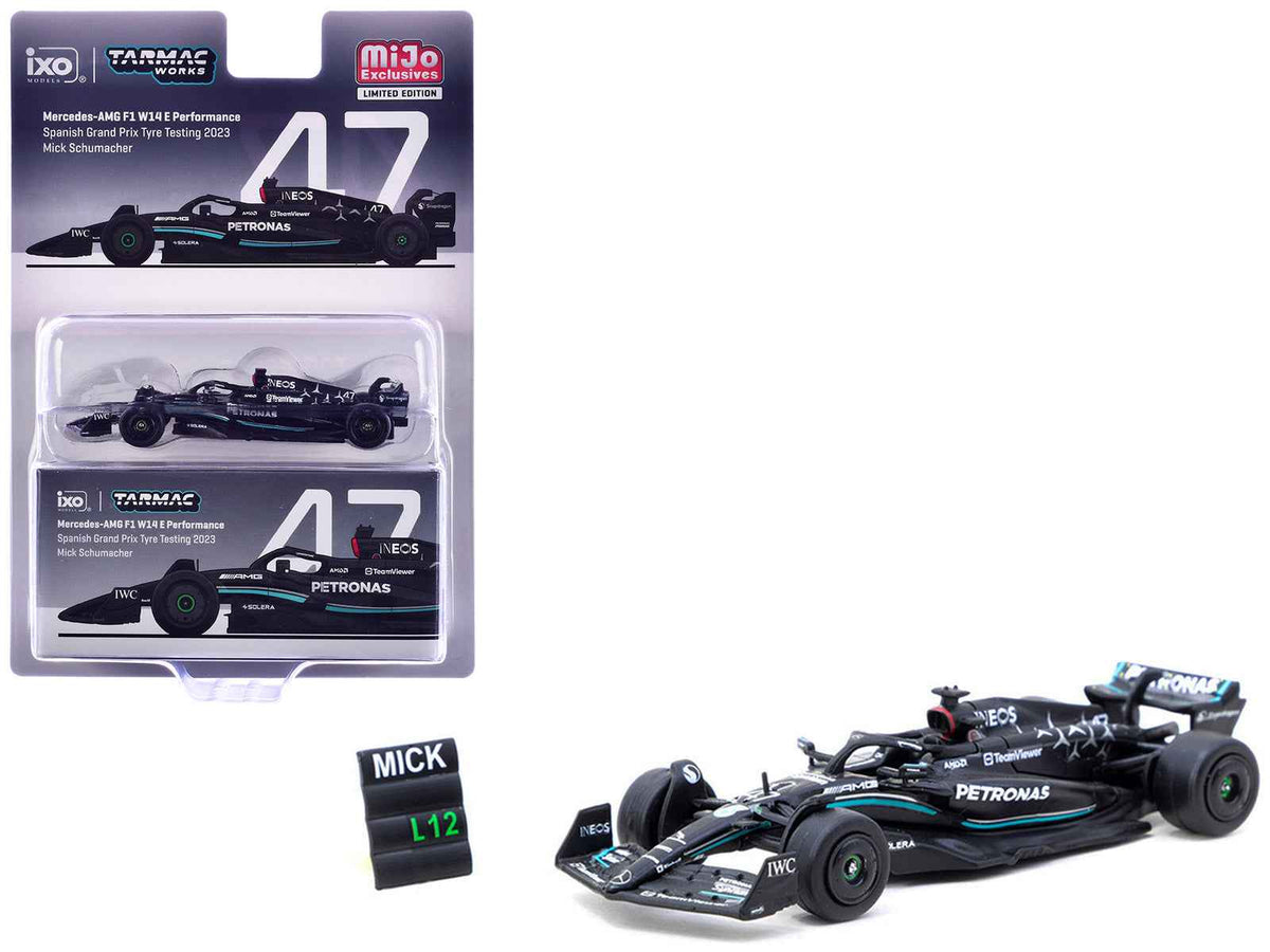 Miniature Mercedes-AMG F1 W14 E Performance #47 Mick Schumacher diecast model by Tarmac Works, with pit board, detailed F1 racing replica.