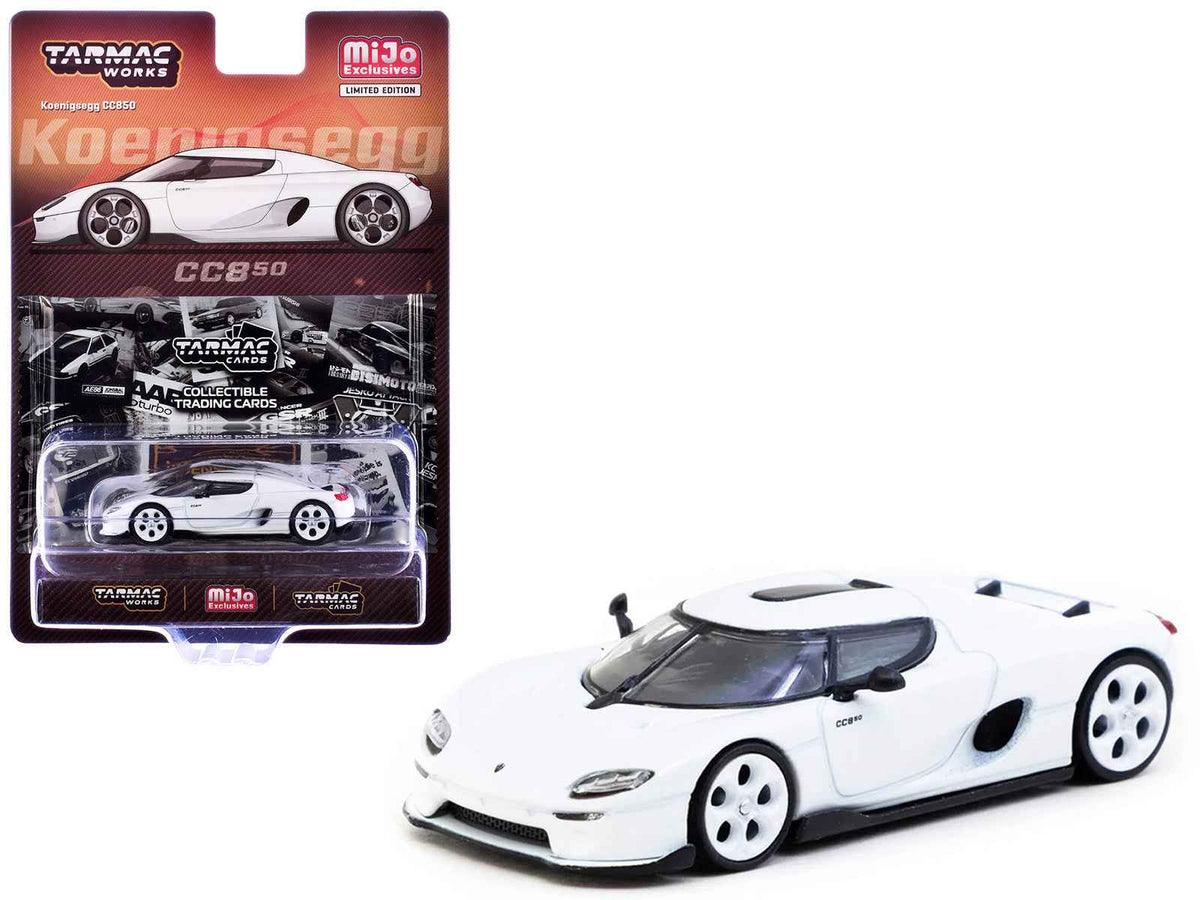 White Koenigsegg CC850 diecast model by Miniature Motors, detailed 1/64 scale car with Tarmac Cards "Global64" series, shown with cards.