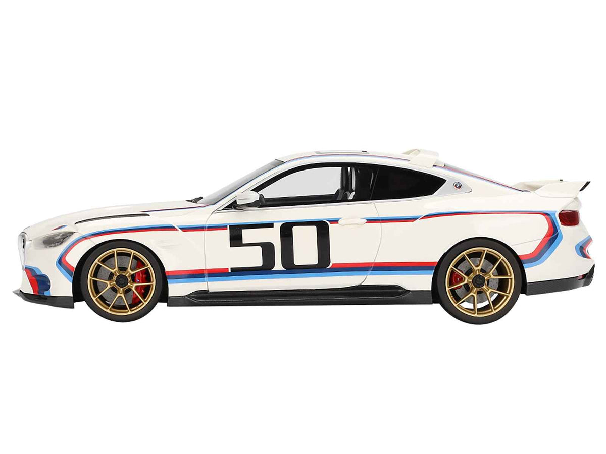 Miniature BMW M4 3.0 CSL model car in white with blue and red stripes, 1/18 scale by Miniature Motors, detailed collectible.