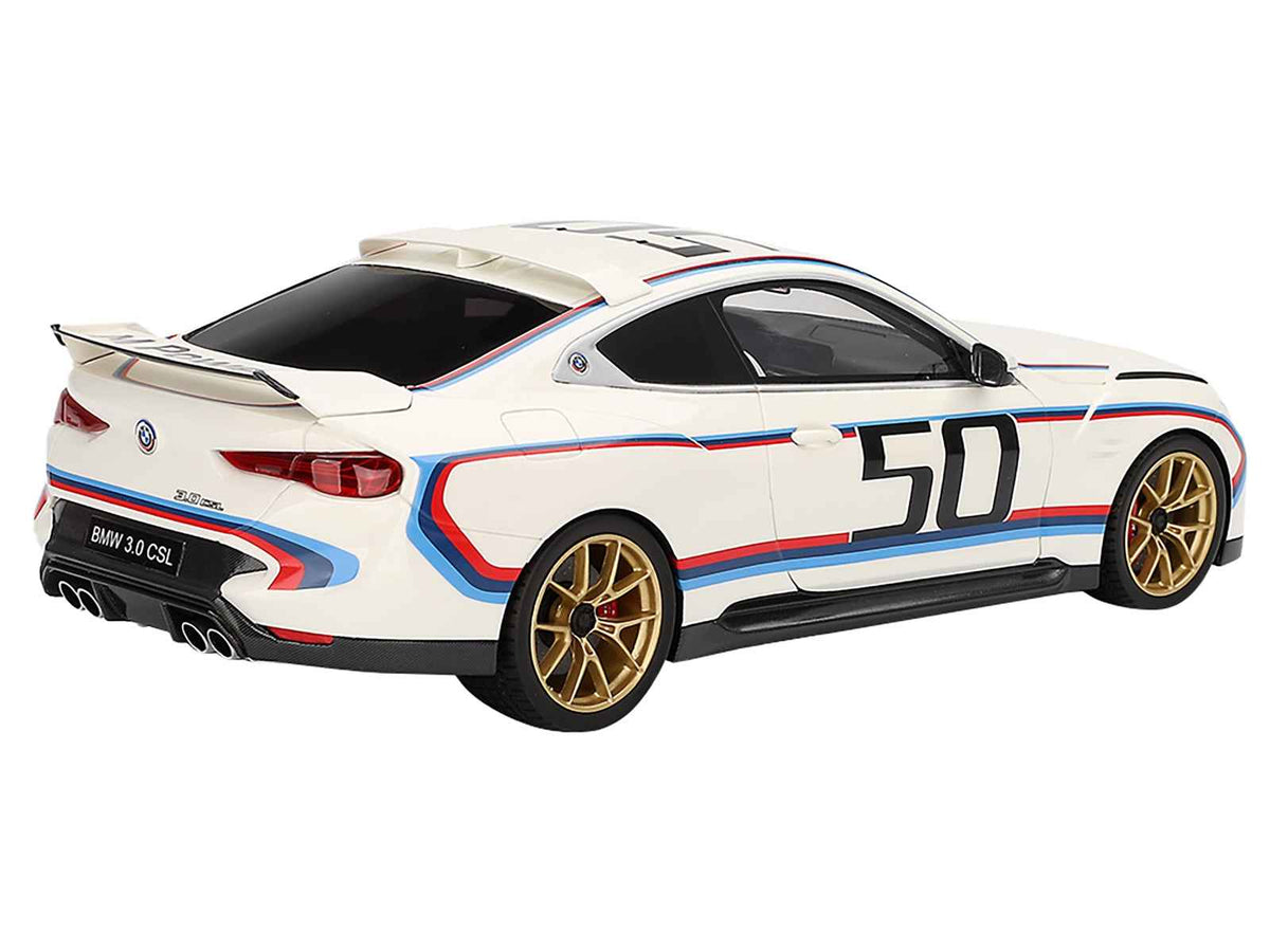 Miniature BMW M4 3.0 CSL model car in white with blue and red stripes by Miniature Motors, detailed 1/18 scale collectible.