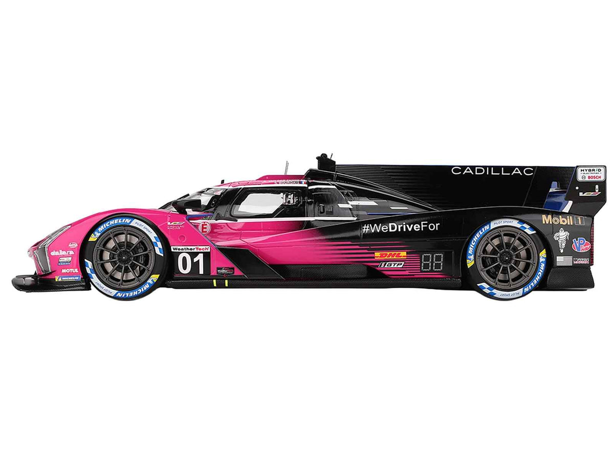Miniature Motors Cadillac V-Series.R #01 model car with Sebastien Bourdais, Scott Dixon, and Renger van der Zande at Petit Le Mans 2024