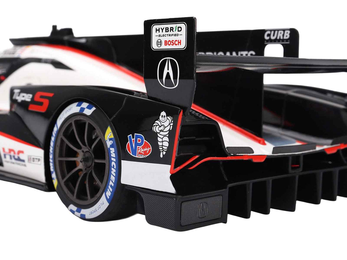 Miniature Acura ARX-06 GTP #93 model car with drivers Kakunoshin Ohta, Alex Palou, Renger van der Zande, and Nick Yelloly.