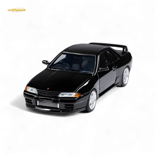 Black Nissan Skyline GT-R R32 Nismo S-Tune diecast model in 1:64 scale, featuring detailed exterior and authentic design.