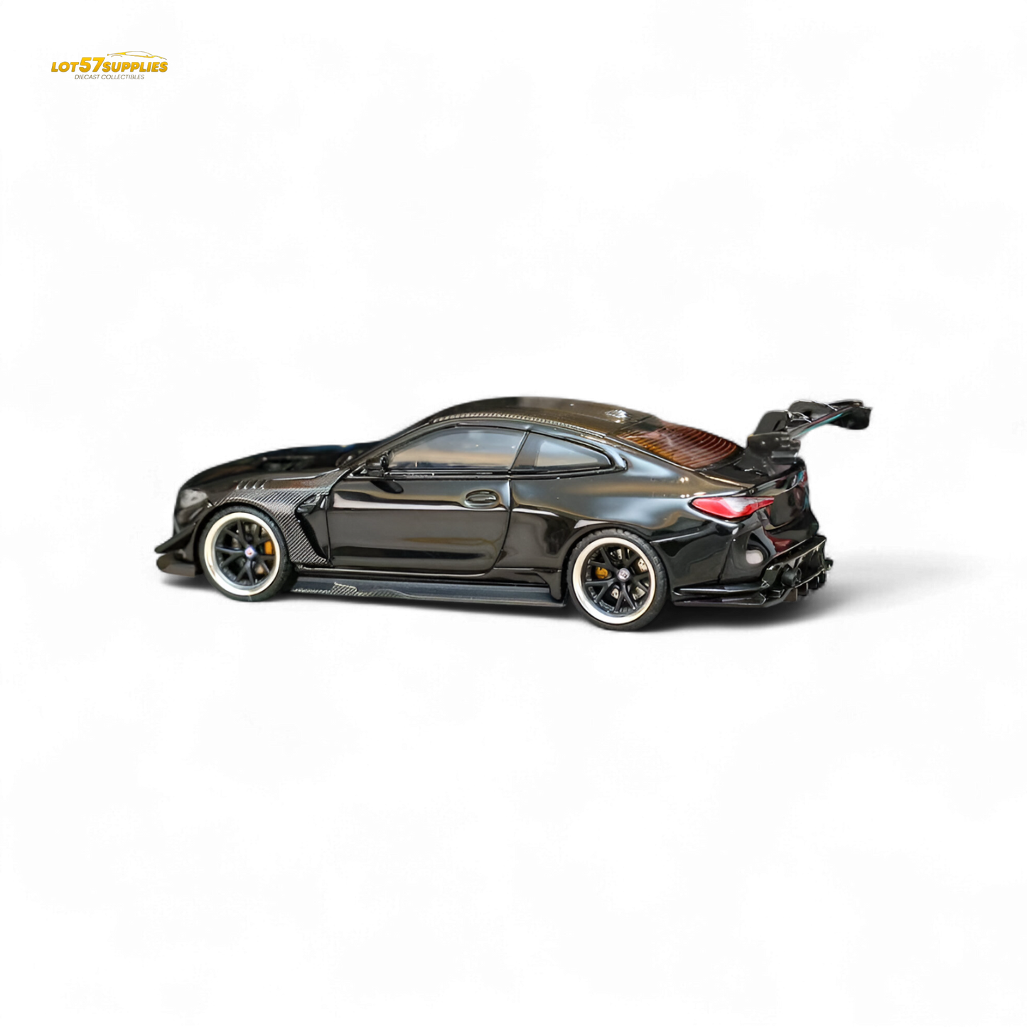 Miniature BMW M4 G82 diecast model with widebody kit in bright black, detailed 1:64 scale replica from Lot57Supplies Diecast Shop